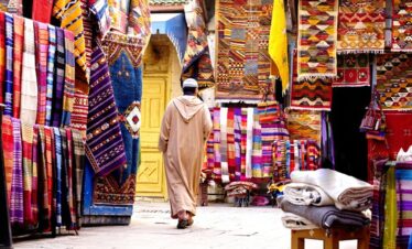 Local man in traditional Moroccan clothing at a craft market