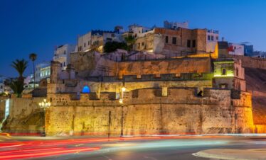 Night view of Tangier, Morocco with illuminated streets and harbor