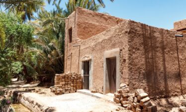 Traditional house in Zagora, southern Morocco with desert landscape