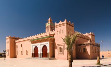 Mosque in Zagora, Morocco with minaret and desert backdrop